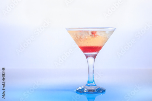 cocktail in a glass on a beautifully illuminated background