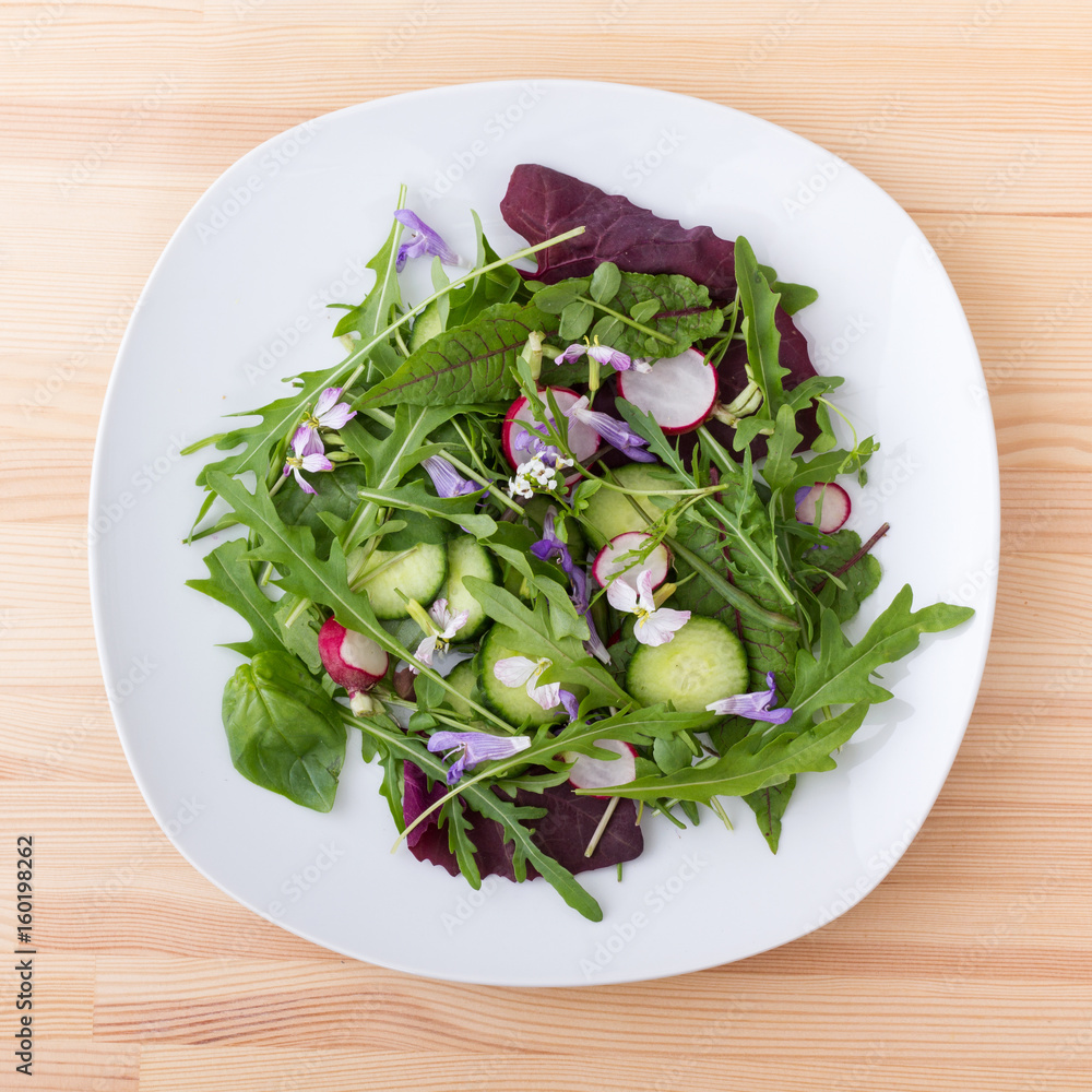 raw vegetables / Salad with different leaves, vegetables and flowers raw vegetables / Salad with different leaves, vegetables and flowers