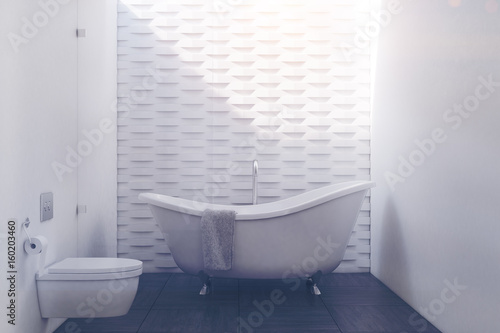 White brick bathroom with a toilet toned