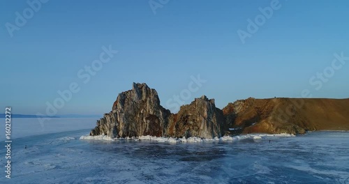 Сибирь, озеро Байкал зимой. Скала Шаманка на острове Ольхон photo