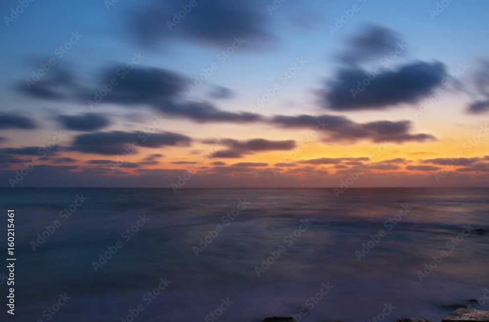 Mediterranean sea and evening sky in Israel. The shot using long exposure and contain soft focus.