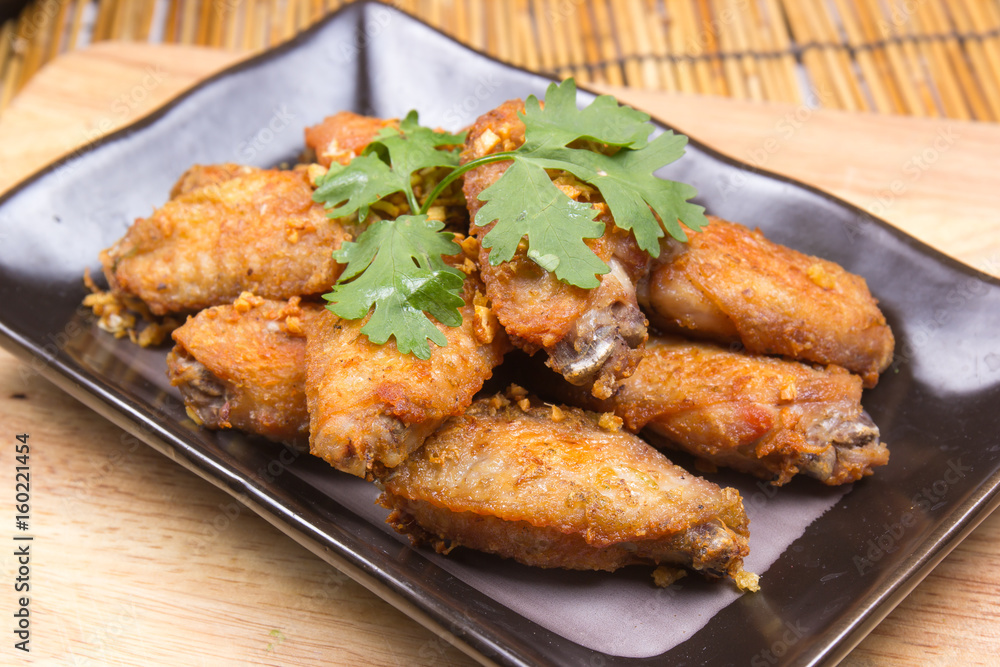 Fried chicken wings on plate