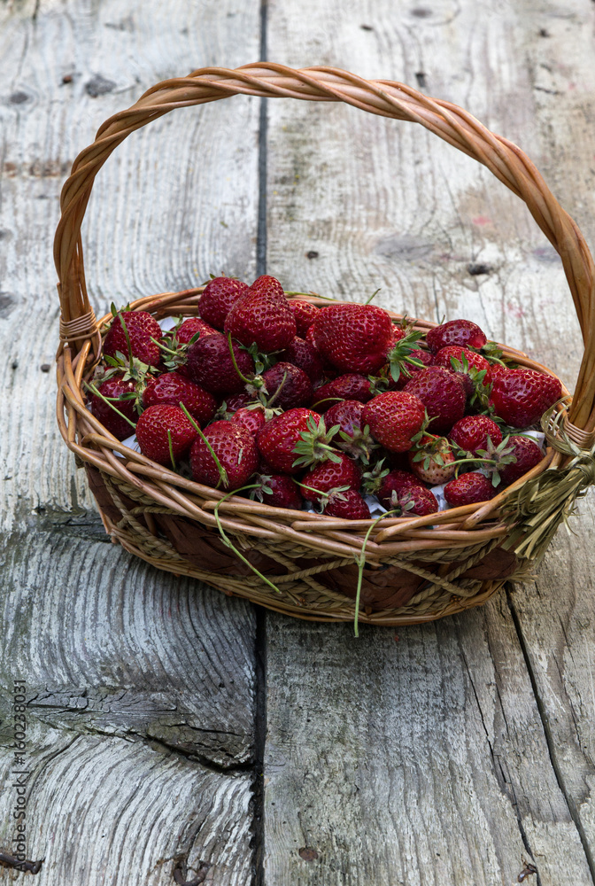 Fresh strawberries on an old wooden surface Fresh strawberries on an old wooden surface