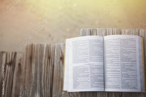 Bible at beach with copy space