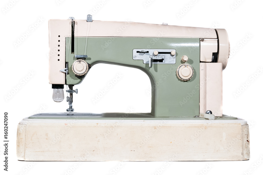 Old sewing machine. Vintage sewing machine on white background.