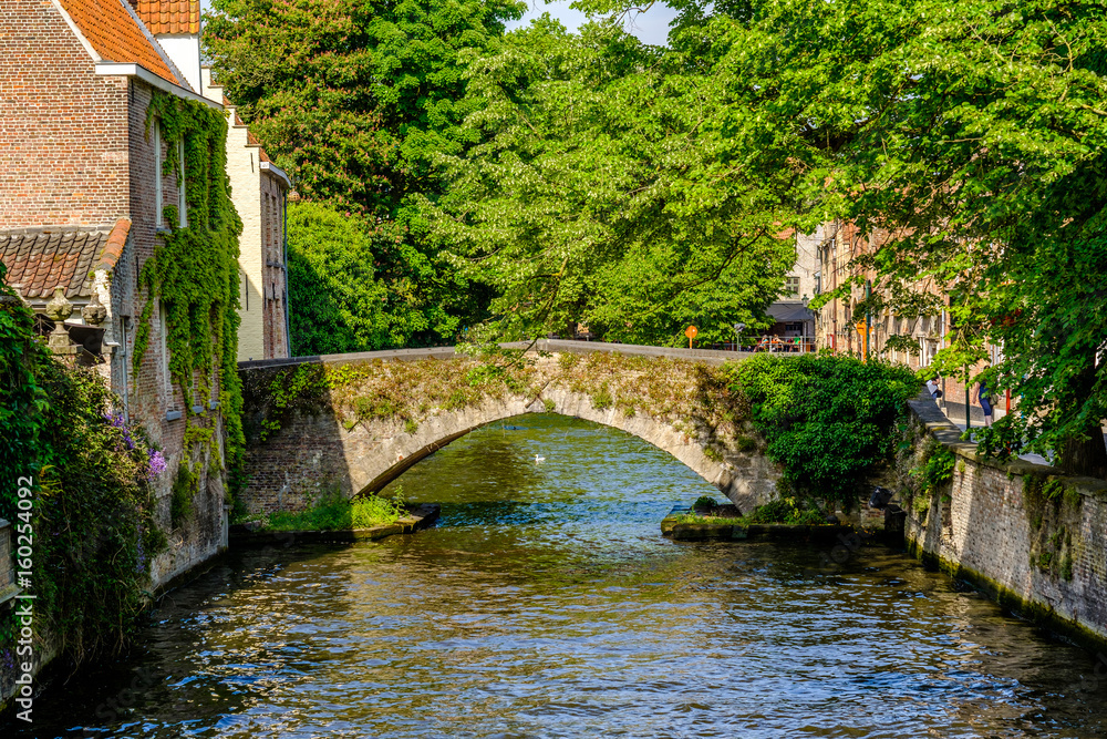 Bruges (Brugge) cityscape with water canal and bridge Bruges (Brugge) cityscape with water canal and bridge