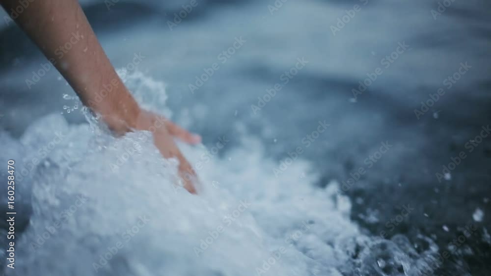 Hand glides over waves Hand glides over waves