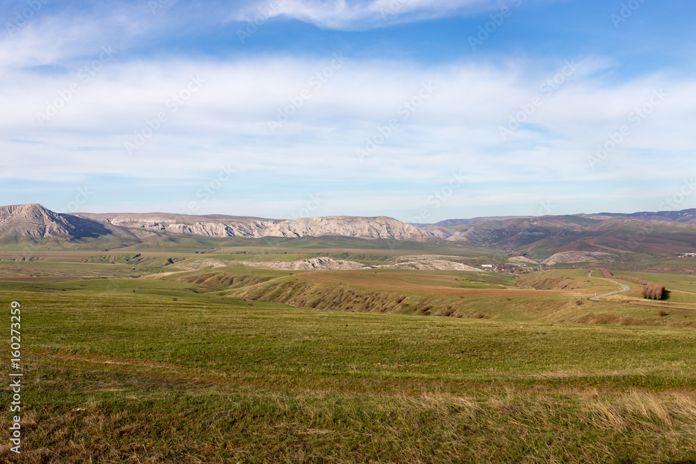 Steppes and mountains in Kazakhstan as a background