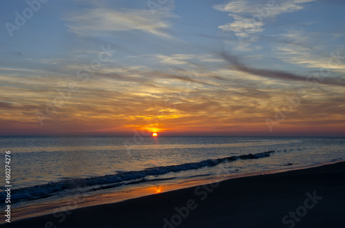 Sun Dips Below Horizon on the Beach
