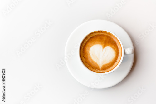 Top view of coffee latte on white background, heart shape styles
