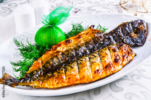 Grilled mackerel on white plate
