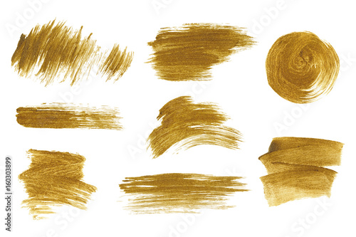 Gold metallic brush stroke set. Isolated hand drawn vector brushes. Gold glitter texture.
