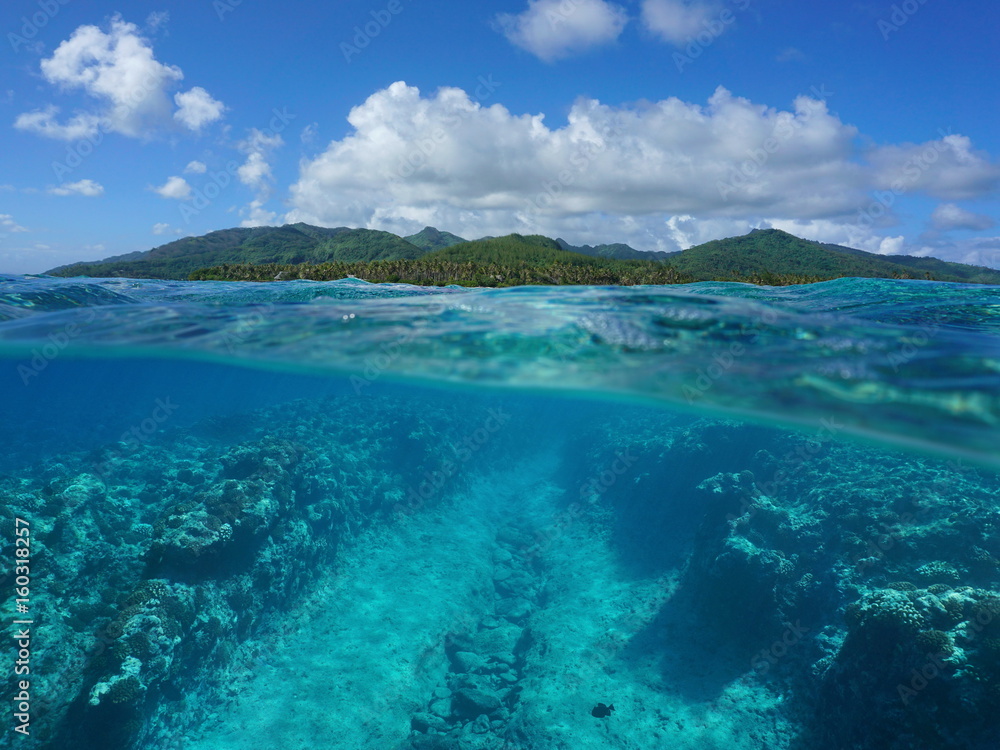Over and under sea surface, South Pacific island and underwater the ocean floor on the fore reef eroded by the waves, Huahine, French Polynesia Over and under sea surface, South Pacific island and underwater the ocean floor on the fore reef eroded by the waves, Huahine, French Polynesia