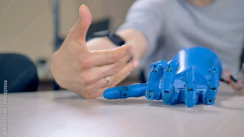 Human arm fingers making example motions for robotic ones. Human arm fingers making example motions for robotic ones.