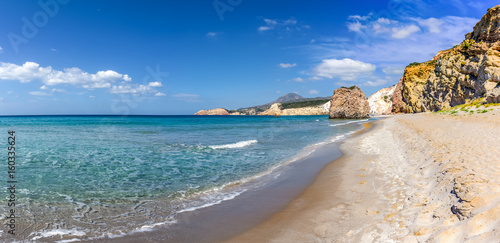 Fototapeta Naklejka Na Ścianę i Meble -  Firiplaka Beach with silver sand and huge colored rocks forming its coastline. South shore of the island of Milos. Cyclades Islands, Greece.