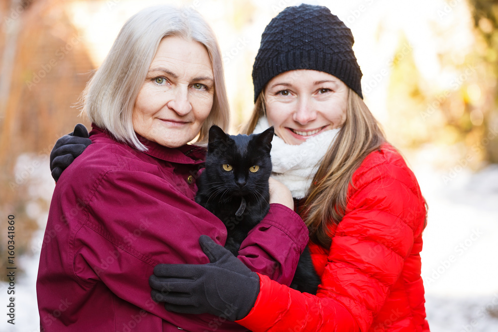 Happy women and the black cat Happy women and the black cat