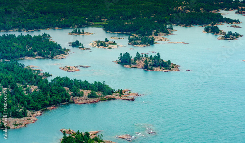 Photography High angle view of coastline with offshore rocks and trees, Toronto, Ontario, Canada