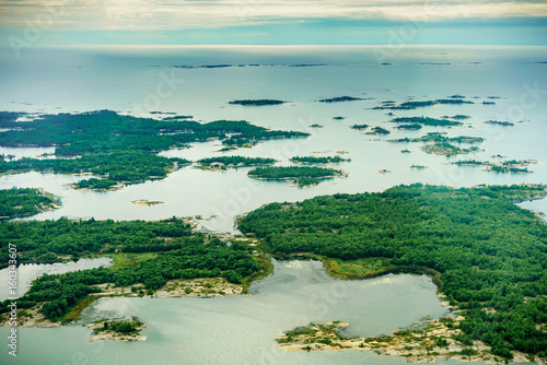 High angle view of coastline with trees and offshore rocks, Toronto, Ontario, Canada.