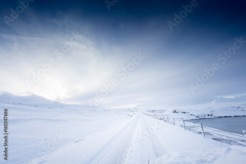 Deep snow covered road and landscape by day, Iceland, Europe. © bruno135_406