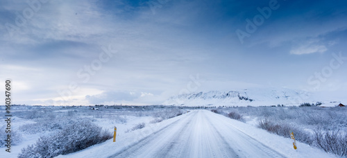Deep snow covered road and landscape by day, Iceland, Europe.