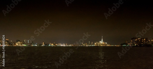 Panoramic view of New York City skyline at night, USA.