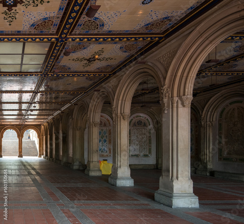 Ornate building interior with traditional columns  arches and detailed ceiling.