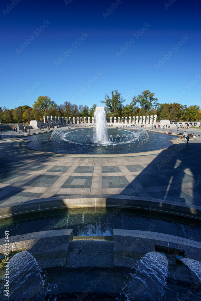 Public space water feature fountains agains blue sky, Washington DC, USA.