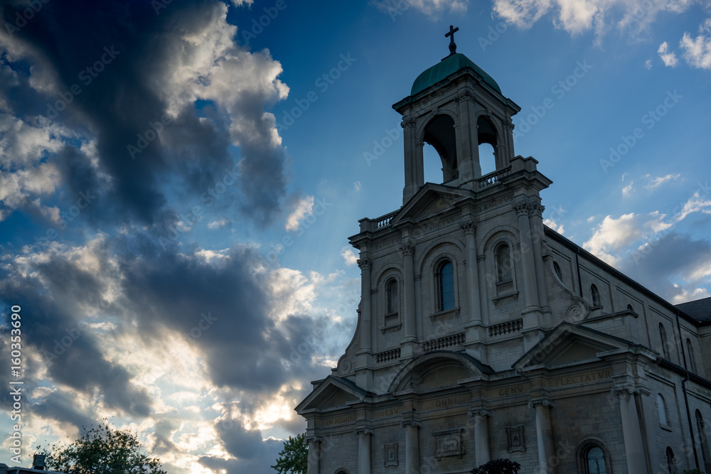 Low angle view of church with dramatic clouds in blue sky Ontario Canada