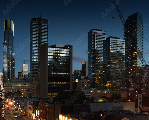 Cityscape at dusk  modern skyscrapers with illuminated windows and Ontario  Canada.