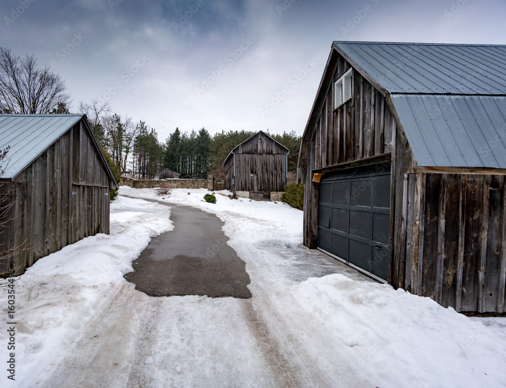 Outdoors, at day, cloudy with barns in Winter, Ontario, Canada.