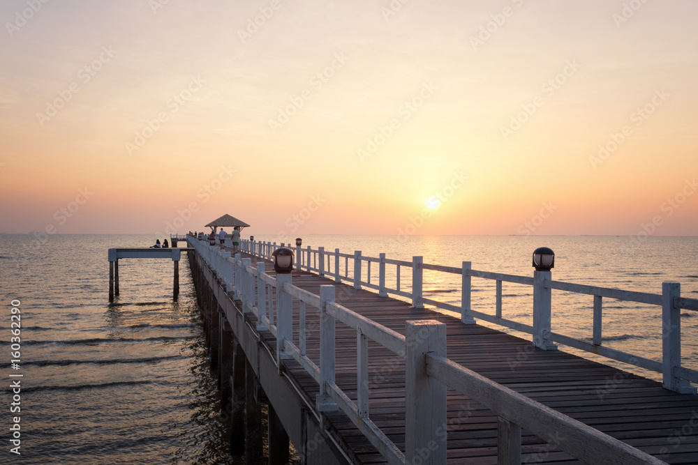 Landscape of Wooded bridge in the port between sunset.
