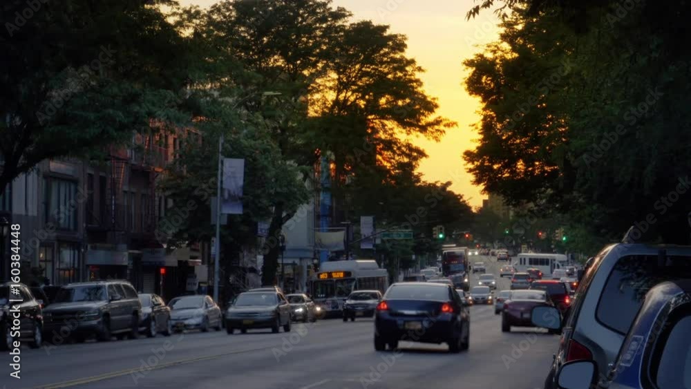 An evening establishing shot of businesses and traffic on Atlantic Avenue in Brooklyn. An evening establishing shot of businesses and traffic on Atlantic Avenue in Brooklyn.