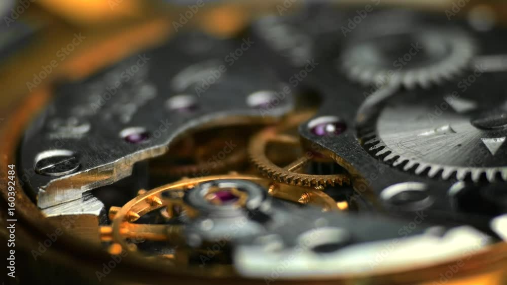 Watch Mechanism / Clockwork / Time Keeping. Oscillating movement of an old mechanical wind up wristwatches. Macro close-up shot. Watch Mechanism / Clockwork / Time Keeping. Oscillating movement of an old mechanical wind up wristwatches. Macro close-up shot.