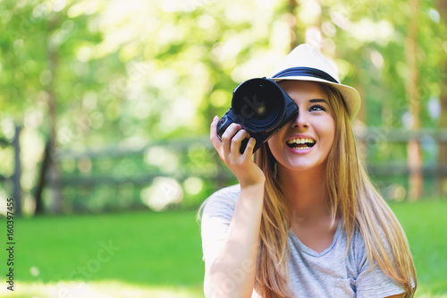 Female photographer with a camera outside