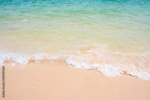 beautiful Soft wave on sandy beach background