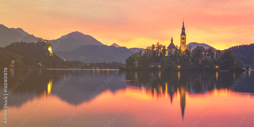 Fairytale, multi-colored dawn over Lake Bled in Slovenia,vintage retro color tone