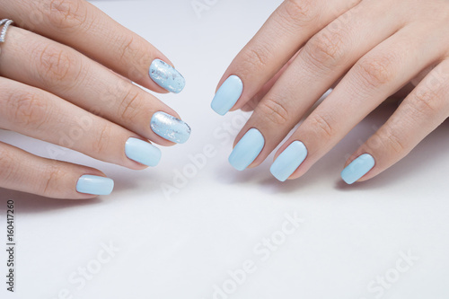 Women's hands and amazing natural nails. Ideal manicure with gel polish and nail art.