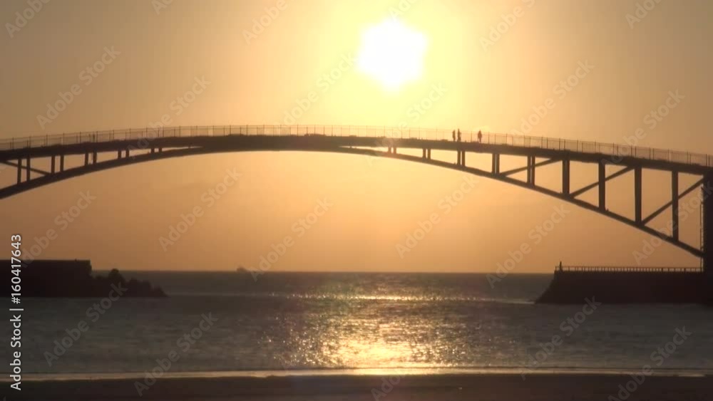 Sunset on the Saikai Rainbow Bridge in Penghu islands, Taiwan. The bridge is officially named Xiying Hong Bridge. The total length is about 200 meters. Sunset on the Saikai Rainbow Bridge in Penghu islands, Taiwan. The bridge is officially named Xiying Hong Bridge. The total length is about 200 meters.