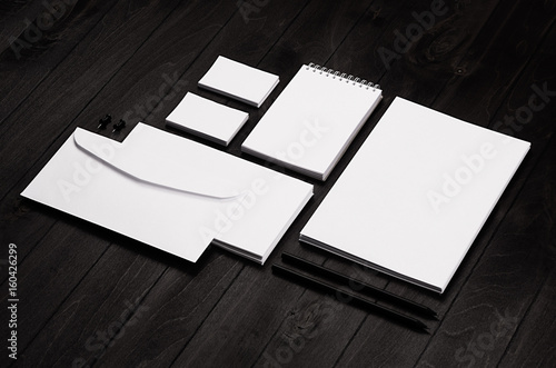 Corporate identity template, stationery set on black stylish wood background. Mock up for branding, business presentations and portfolios.