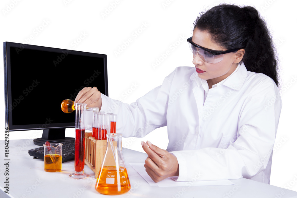 Beautiful woman doing experiment with liquid Beautiful woman doing experiment with liquid