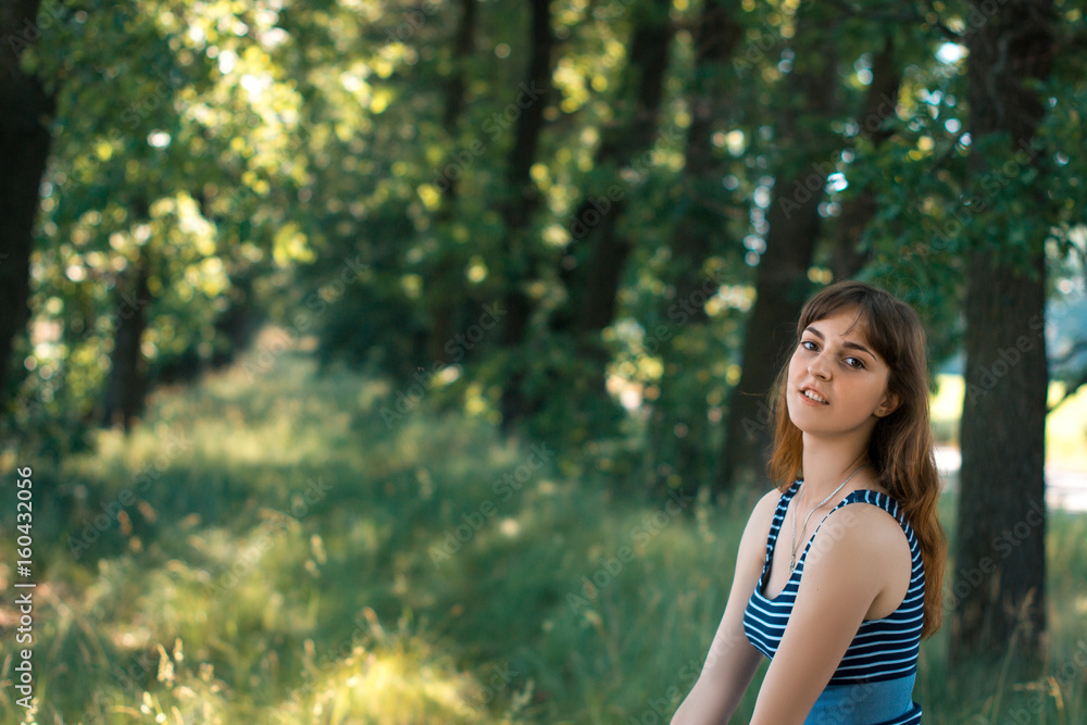 Beautiful young happy girl on a summer day resting on the nature. Beautiful young happy girl on a summer day resting on the nature.