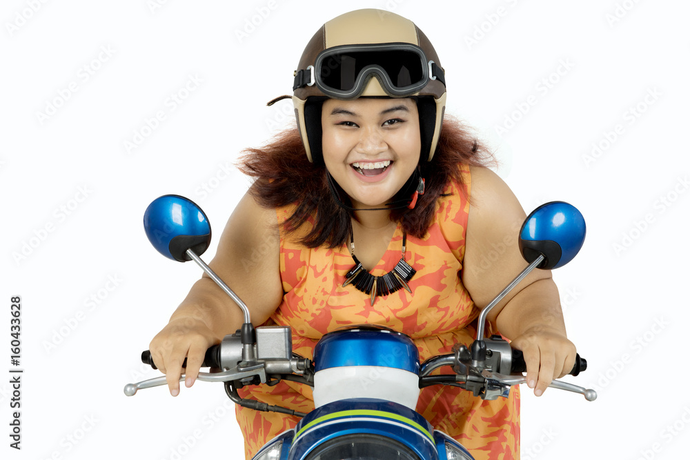 Fototapeta premium Fat woman driving motorcycle