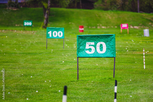 Fotografie Yard signs in driving range