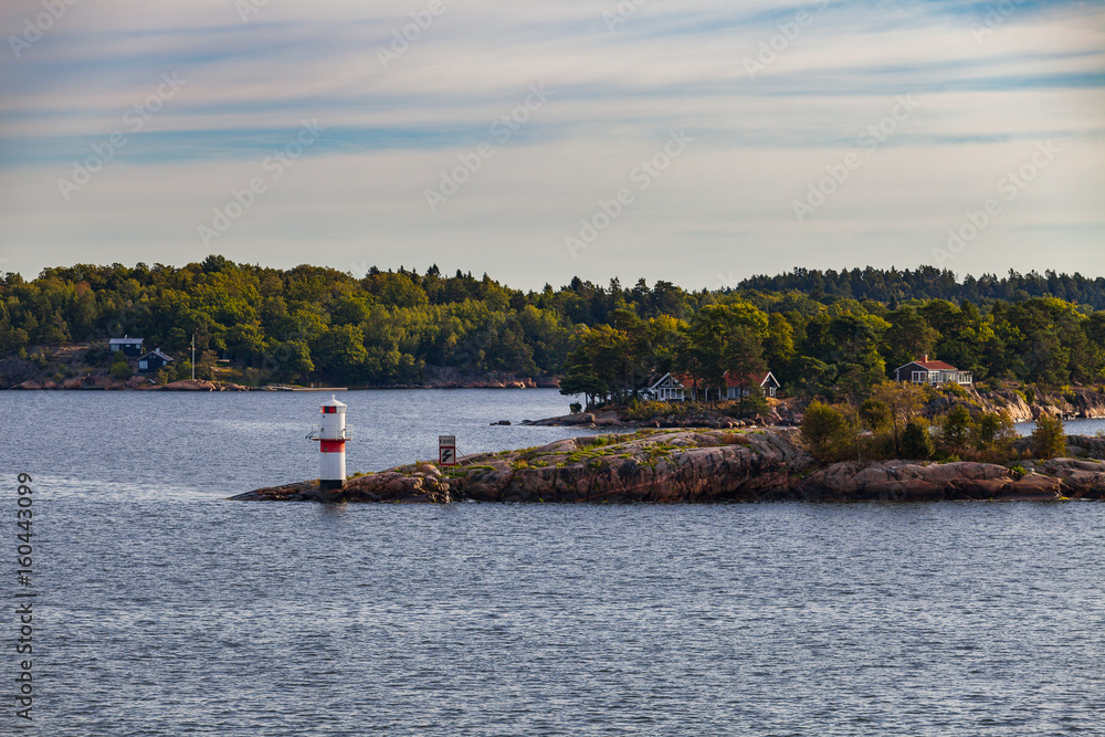 Obraz premium Beautiful view of island and coast on ferry route to Stockholm, Sweden. Sunrise time.