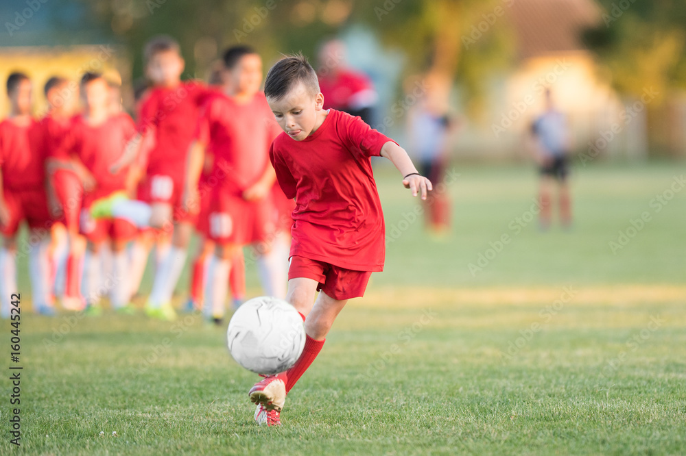 Kids soccer football - children players match on soccer field