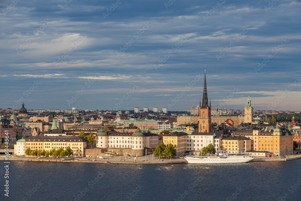 Aerial view of central part of old town with embankment and ship. Sunset time. Stockholm, Sweden
