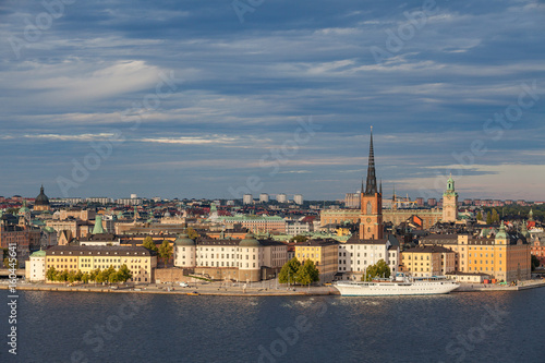 Aerial view of central part of old town with embankment and ship. Sunset time. Stockholm, Sweden