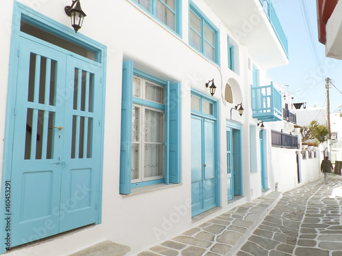 Charming small alley with white and blue colored buildings, Mykonos town on Mykonos island, Greece