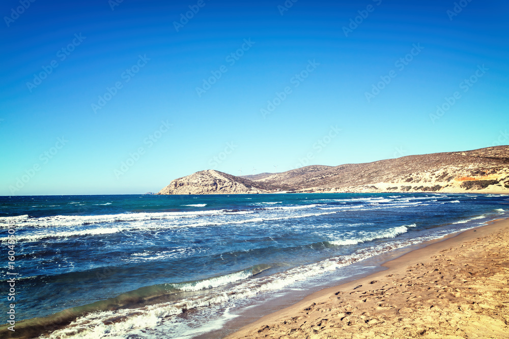 Beautiful seascape, yellow sandy beach and blue water