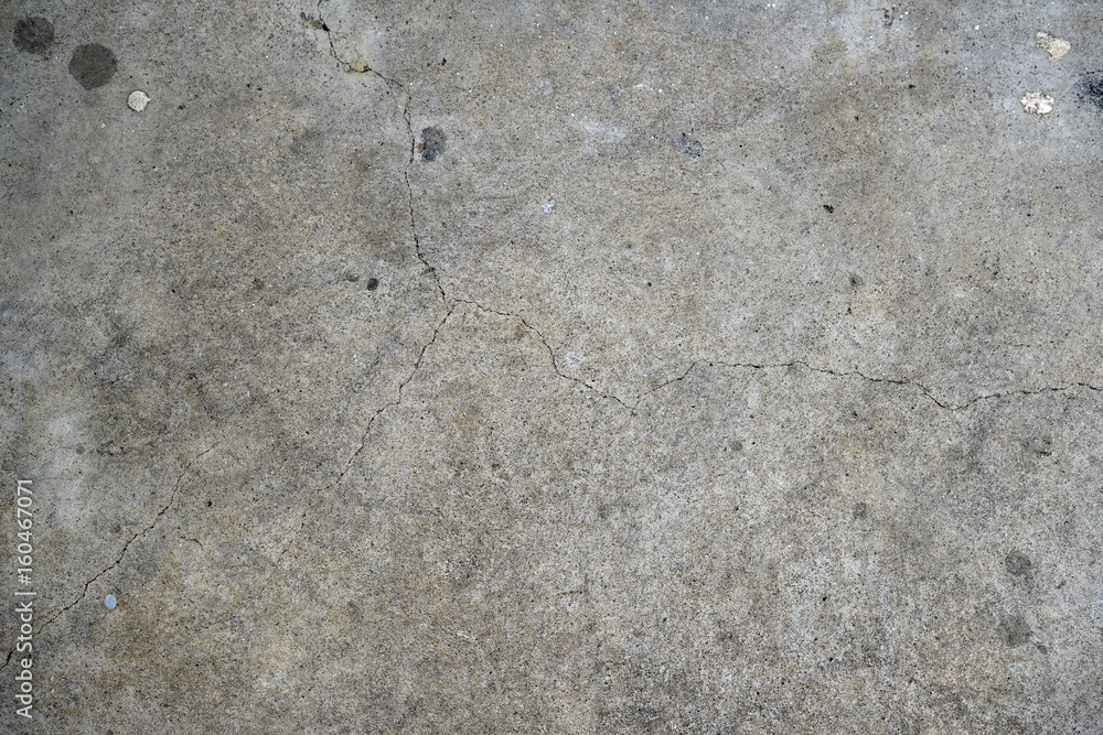 Naklejka premium Concrete pavement with cracks texture